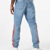 Uomo Vision of Super Pantaloni | Denim Blu Con Fiamme Tribali Rosse